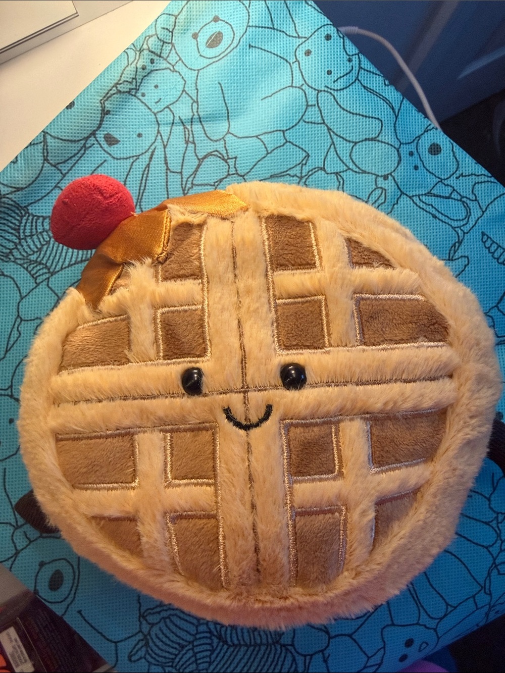 Jellycat Tan Waffle Plush Pet Bed with Red Cherry Accent